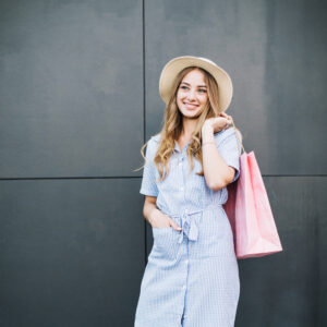 charming woman with purchase bag